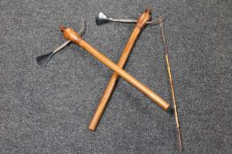 A pair of tribal axes together with a bamboo handled fishing spear