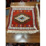 A fringed Caucasian mat,