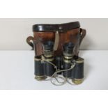 A pair of antique French Hunsicker & Alexis field glasses in leather case