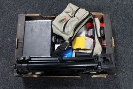 A box of cameras and camera accessories