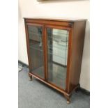 A double door mahogany display cabinet