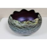 An iridescent Austrian amethyst glass bowl in the manner of Loetz,