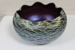 An iridescent Austrian amethyst glass bowl in the manner of Loetz,