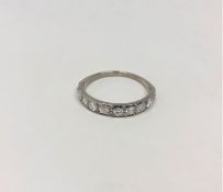 An antique platinum half eternity ring, the total diamond weight estimated at 0.