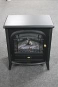 A Dimplex electric fire in the form of a log stove