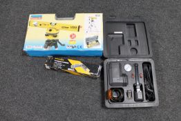 A boxed Power Fix laser level kit together with a cordless screwdriver and car compressor kit