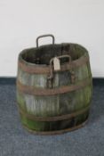 An antique oak coopered wine barrel