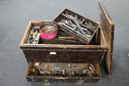 An antique pine joiner's chest containing tools fitted with drawers internally