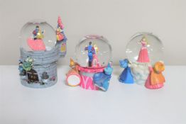 Three Disney snow globes : Sleeping Beauty