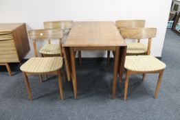 A six piece mid twentieth century teak dining room suite comprising of low cocktail sideboard,