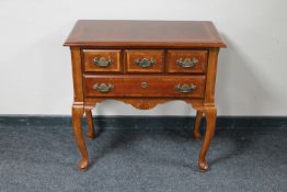 A mahogany Georgian style low boy fitted with two drawers