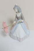 A Lladro figure - Oriental figure with parasol