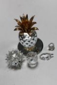 A Swarovski pineapple on mirrored stand together with four further crystal ornaments Hedgehog, Duck,