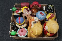 A box of novelty cookie jars, ginger bread tins,