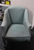 A Victorian tub chair upholstered in a turquoise fabric