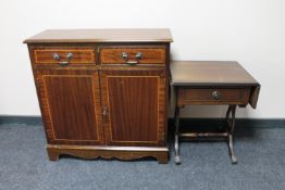A Regency style double door cupboard and a drop leaf sofa occasional table