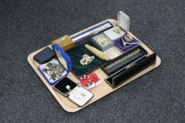 A tray of costume jewellery, treen box, needle case containing needles,