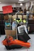 A carpet washer, Henry vacuum, garden sprayer, lawn raker,