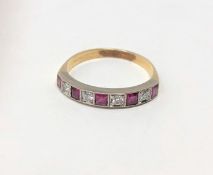 An 18ct gold ruby and diamond half eternity ring,