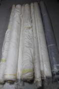 Eight rolls of fabric