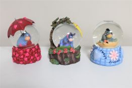 Three Disney snow globes : Eeyore