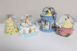 Four Disney snow globes : Beauty and the Beast