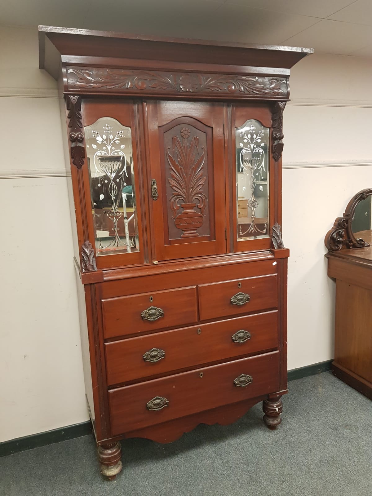 A Victorian mahogany mirrored press, width 130 cm.