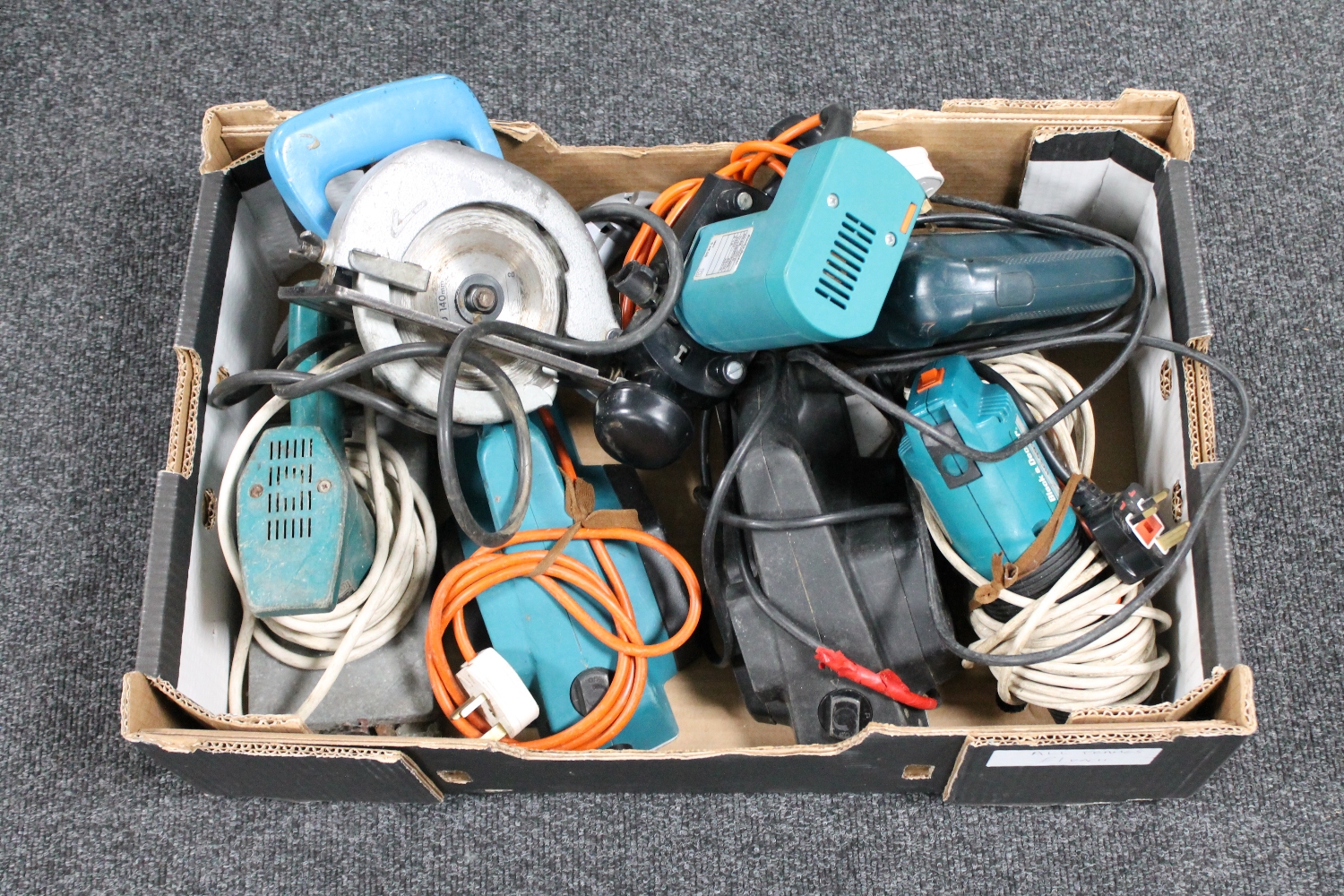 A box of a quantity of assorted power tools including Black and Decker jigsaw,