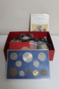 A box of foreign coins, pre decimal British coins, Britains first decimal coin set,