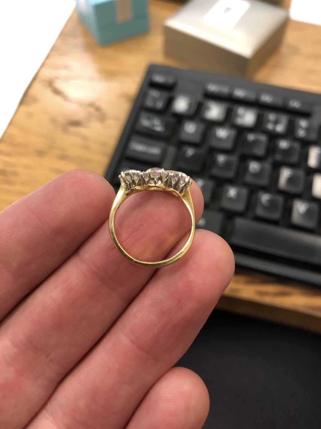 An 18ct gold three-stone diamond ring, - Image 2 of 6