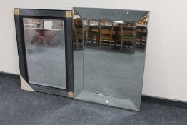 A contemporary all glass framed mirror together with a black framed bevelled edge mirror