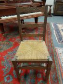 A set of nine carved oak ladder backed rush seated chairs