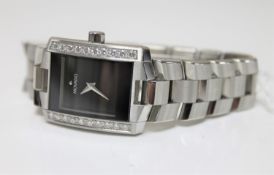 A Movado diamond set stainless steel wristwatch, set with approximately 1 carat of diamonds,