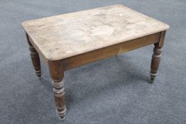 An antique farmhouse kitchen table CONDITION REPORT: 122cm long by 84cm wide by