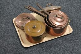 A tray of set of three antique copper cast iron handled lidded pans together with a further copper