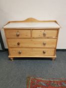 A Victorian pine four drawer chest with marble top, width 112 cm.