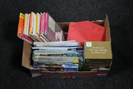 A box of Beatrix Potter VHS box set, Wills and Senior cigarette cards, ordnance survey maps,