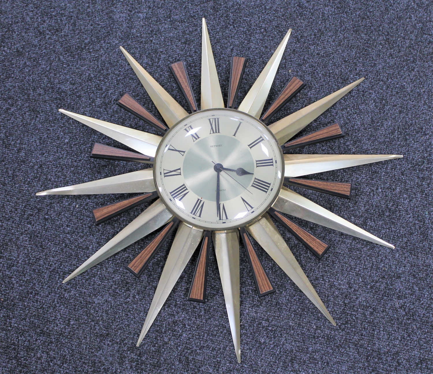 A 1970's Metamec battery operated sunburst wall clock