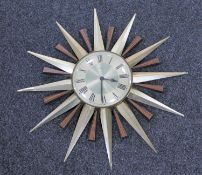 A 1970's Metamec battery operated sunburst wall clock