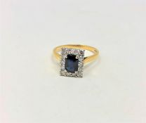 An 18ct gold sapphire and diamond cluster ring,