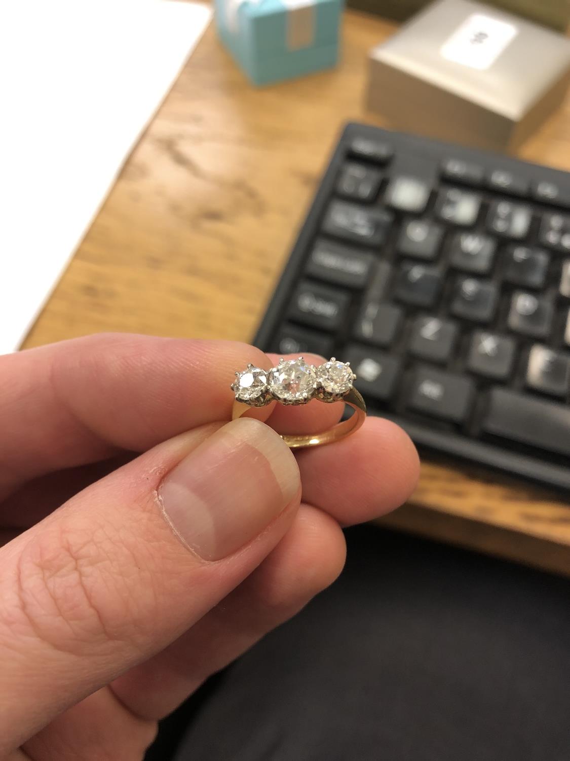 An 18ct gold three-stone diamond ring, - Image 3 of 6