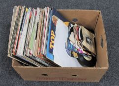 A box of vinyl LP records and 7" singles : easy listening, The Beach Boys,