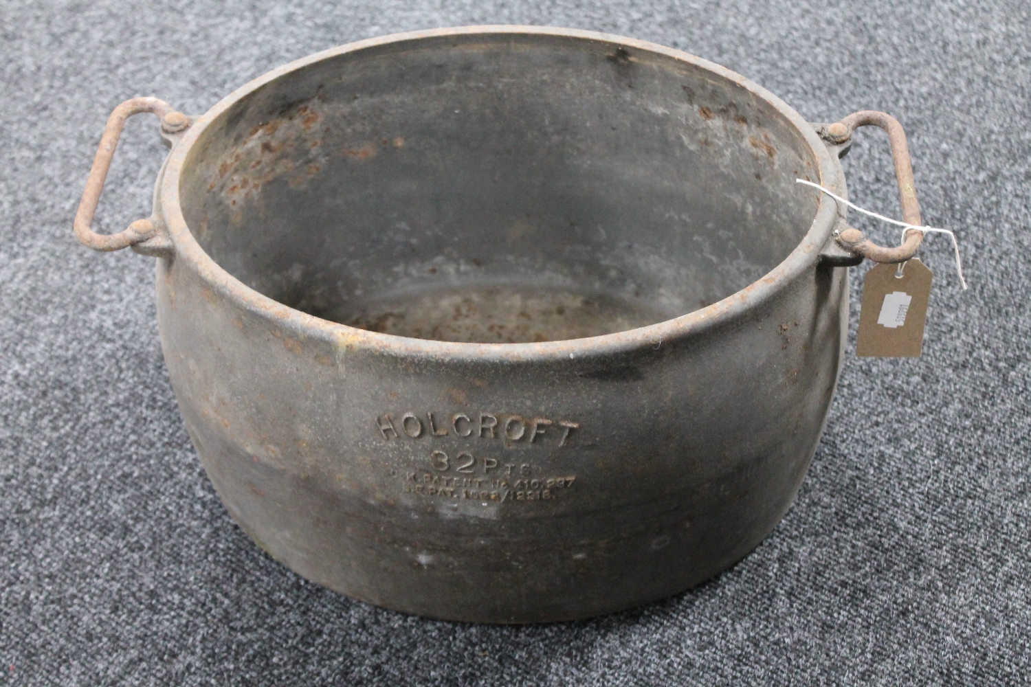 An antique cast iron Holcroft 32 pint cooking pot