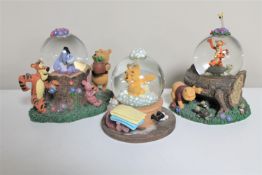 Three Disney snow globes : Winnie the Pooh and Friends