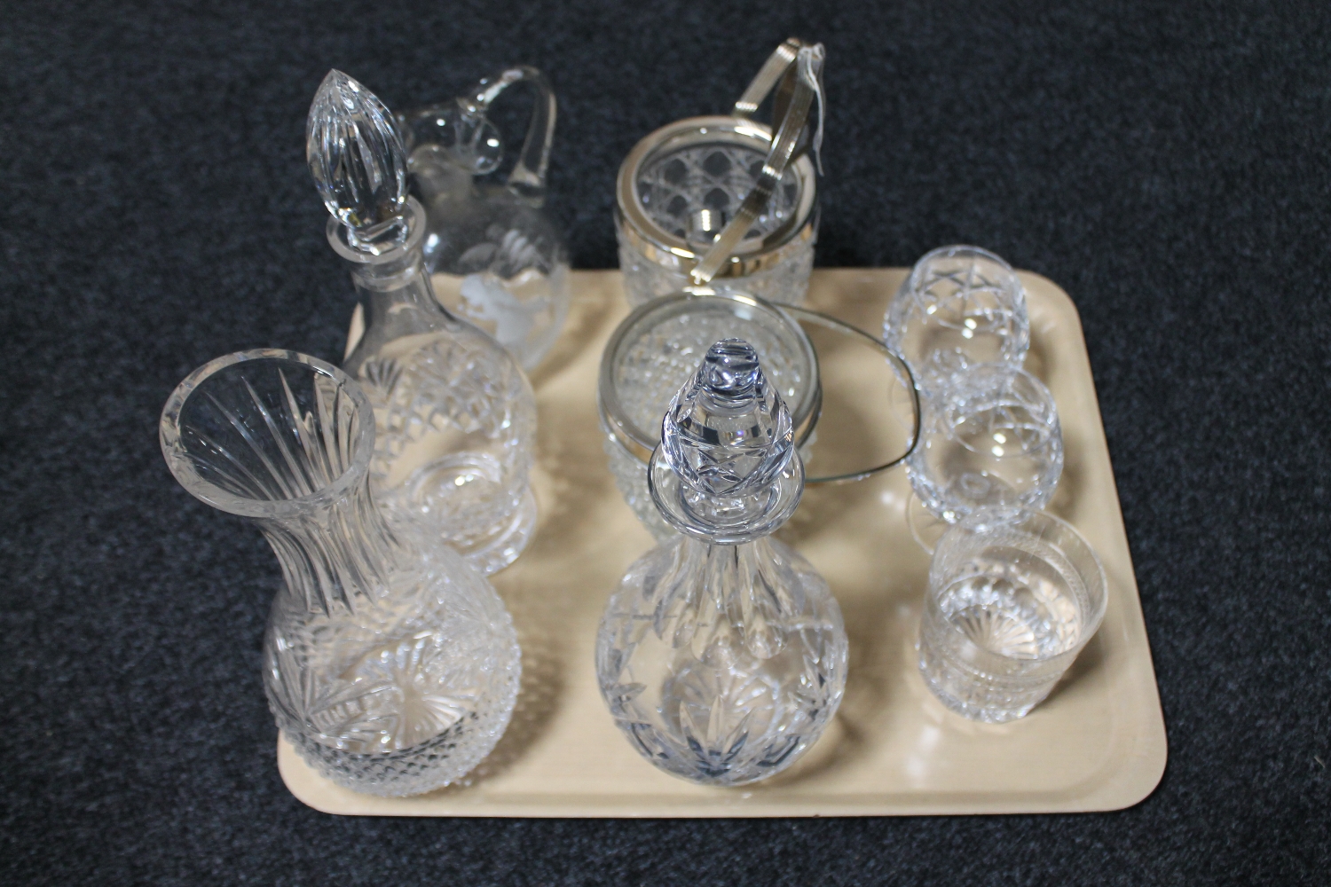 A tray of crystal decanters, ice buckets, glasses,