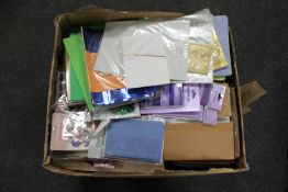 A box containing a large quantity of crafting items