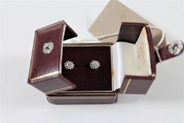 A pair of 9ct gold diamond cluster earrings