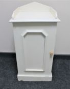 A painted antique pot cupboard