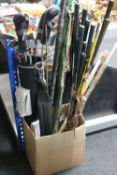 A box of child's golf bag containing clubs, snooker cue in tube,