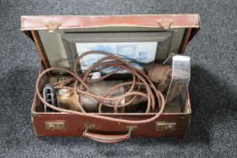 A vintage leather luggage case, framed print, embroidery,